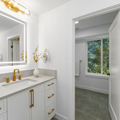 white cabinets with gold fixtures